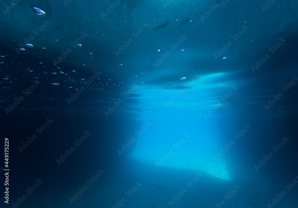 blue colored clear underwater surface texture with ripples  splashes and bubbles