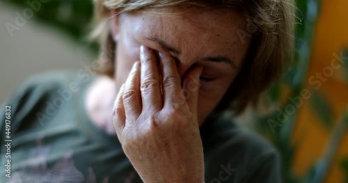 Wallpaper Mural Tired older woman rubbing eyes and face with hand Torontodigital.ca