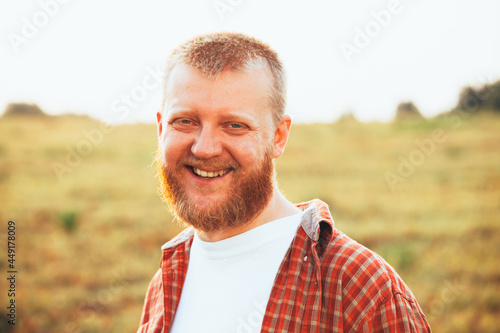 Happy bearded smiling man photo