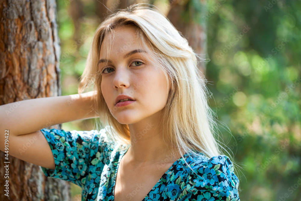 Portrait of a young blonde girl in a turquoise dress Portrait of a young blonde girl in a turquoise dress