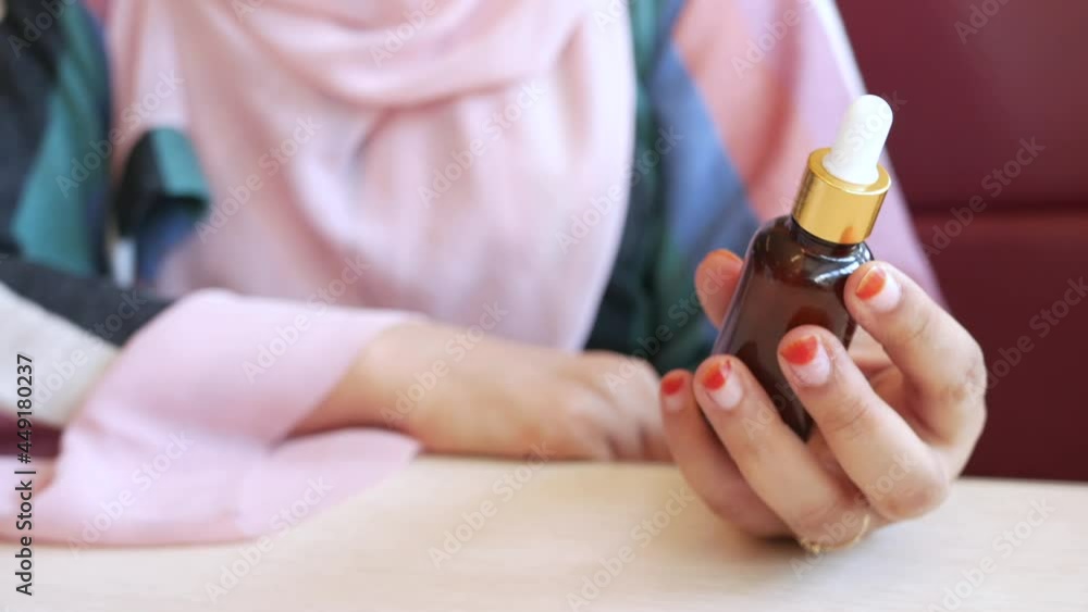 women hand hold eucalyptus essential oils glass bottle women hand hold eucalyptus essential oils glass bottle