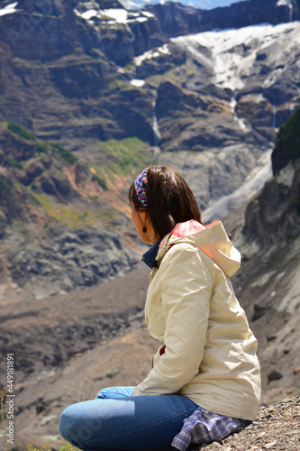 woman sitting cross-legged on the mountain