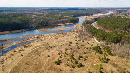 Aerial view of the Teterev river and the forest near the river photo