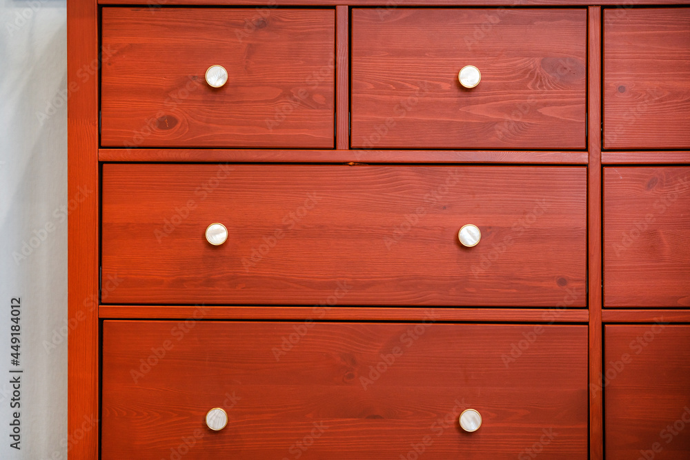 Red chest of drawers with beautiful handles Red chest of drawers with beautiful handles