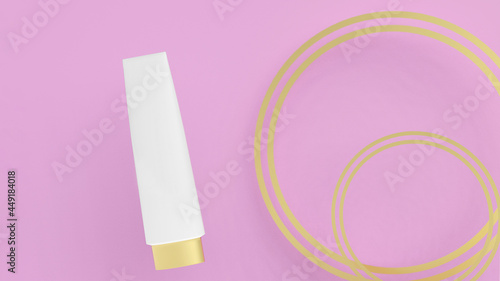 3D rendering illustration. Blank cream tube with golden cap on the pink with golden rings background. Makeup, cosmetic tube for displaying your brand. Trendy minimal design, mock up banner.