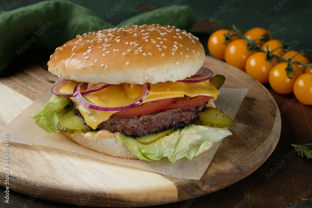 A close up of a sandwich sitting on top of a wooden table A close up of a sandwich sitting on top of a wooden table