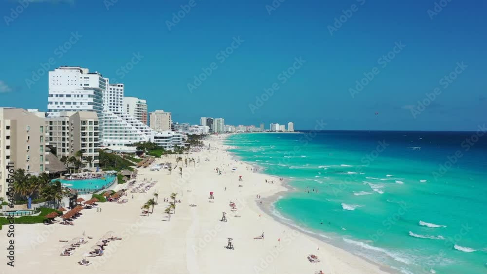 Camera flies over white sandy beach and toward water in Cancun Camera flies over white sandy beach and toward water in Cancun