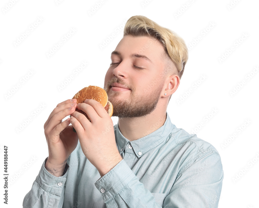 Young man with tasty vegan burger on white background Young man with tasty vegan burger on white background