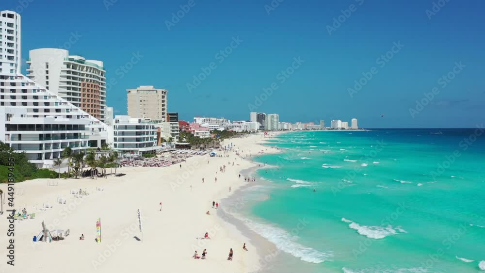 Beautiful white sandy beach at water's edge in Cancun Beautiful white sandy beach at water's edge in Cancun