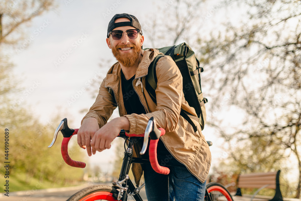 Fototapeta premium handsome bearded man traveling with bicycle in morning