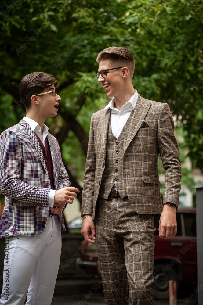 Two young businessmen communicate and solve problems with each other Two young businessmen communicate and solve problems with each other