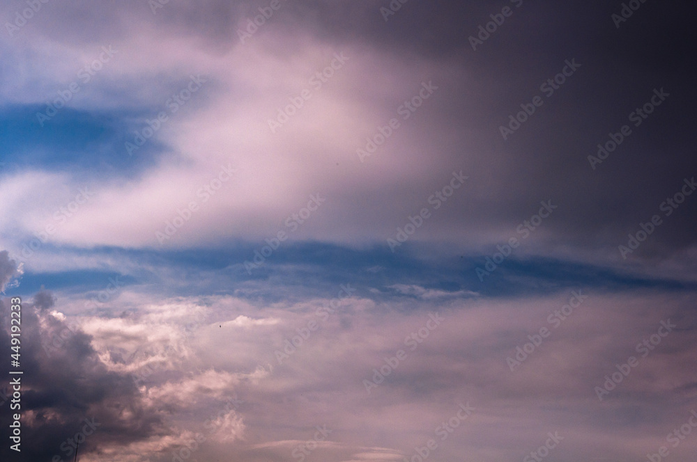 Dramatic blue sky with white and grey clouds