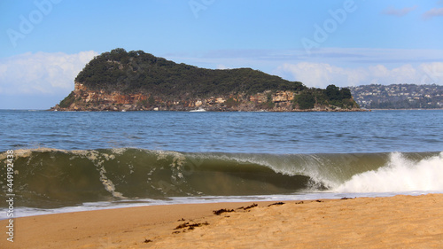 wave breaking on beach near lion island