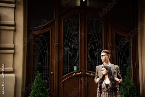 Wallpaper Mural Young couple in eyeglasses, formal clothes  Torontodigital.ca