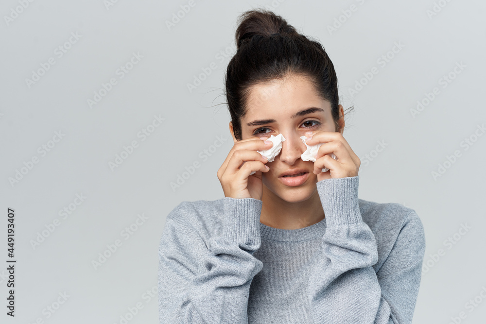 sick woman on wipes her nose health problems light background sick woman on wipes her nose health problems light background