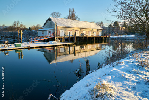 Scotch Pond Snow Steveston. The historic net shed at Garry Point, Steveston covered in snow. Richmond, BC.