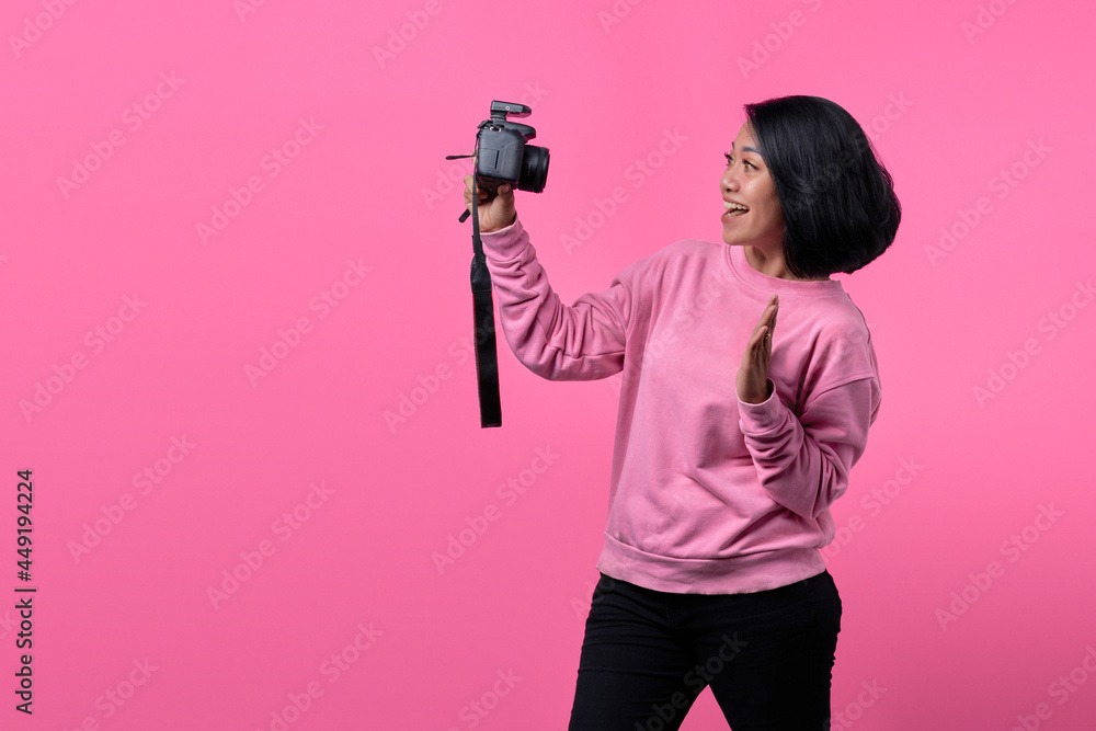 Beautiful girl taking a self portrait with professional camera. Asian girl selfie Beautiful girl taking a self portrait with professional camera. Asian girl selfie
