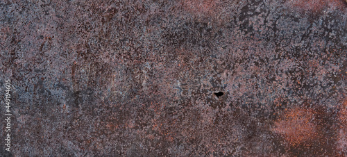 Rusty iron sheet with little hole