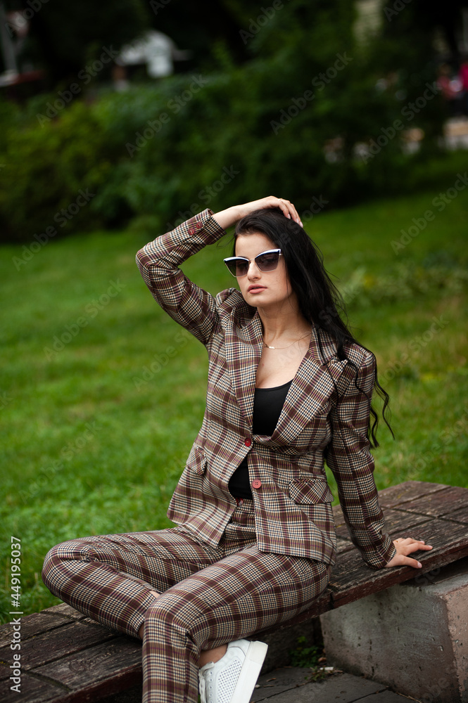 Fashion young woman in formal clothes and sunglasses Fashion young woman in formal clothes and sunglasses