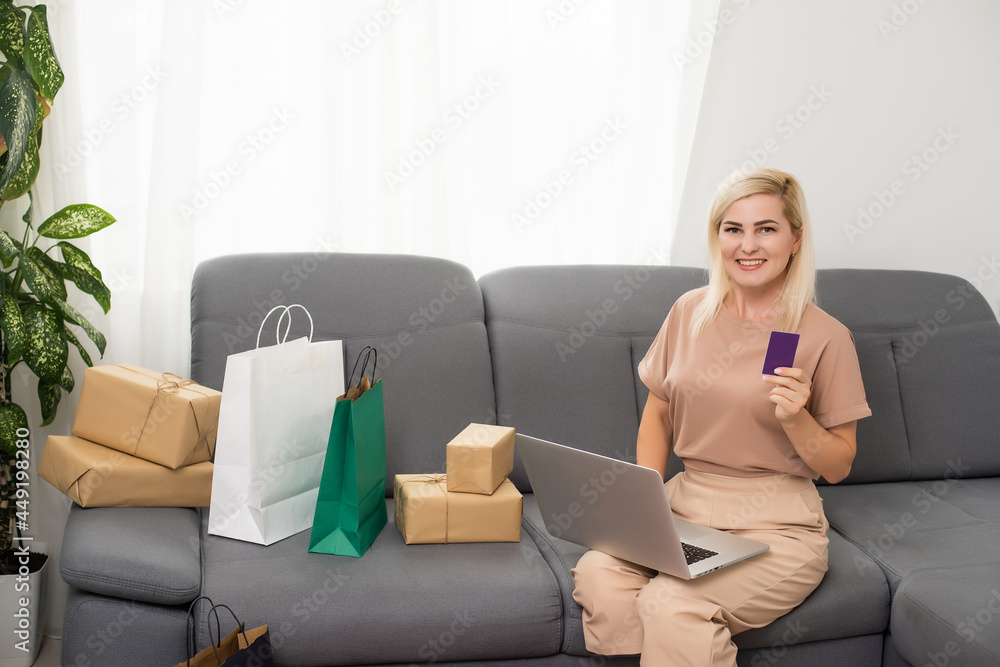 woman shopaholic buy bags bargains use computer credit card to pay easy adore her purchases in comfort house indoors woman shopaholic buy bags bargains use computer credit card to pay easy adore her purchases in comfort house indoors