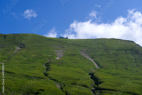 Fototapeta Naklejka Na Ścianę i Meble -  Panoramic view of ridge of mountain Brienzer Rothorn at Bernese Highland on a beautiful sunny summer day. Photo taken July 21st, 2021, Flühli, Switzerland.