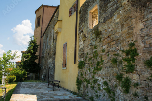 Residential buildings which form part of the surrounding town walls in the historic medieval village of Buje in Istria  Croatia 