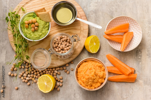 Wallpaper Mural Composition with tasty hummus, lemon and chickpeas on light background Torontodigital.ca