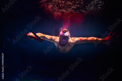 Fotografie A Viking with an axe in water the color of blood
