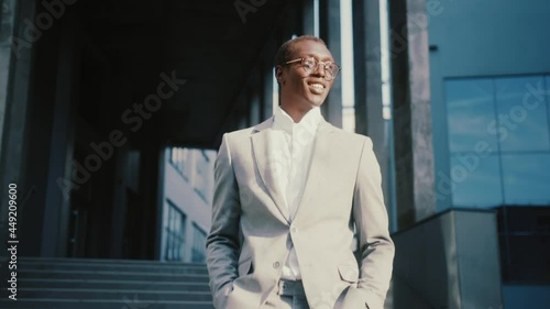 Wallpaper Mural Successful afro-american attractive young lawyer or businessman walking in contemporary business district office neighbourhood outdoors. Torontodigital.ca