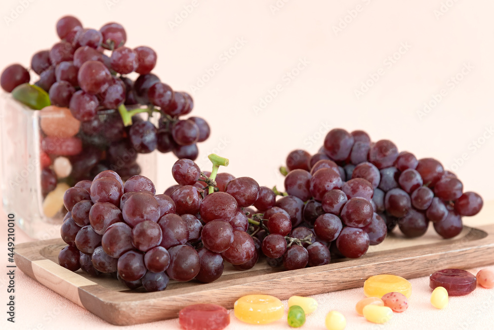 Ripe candy snaps grape fruit put in pink steel basket.pink background.
