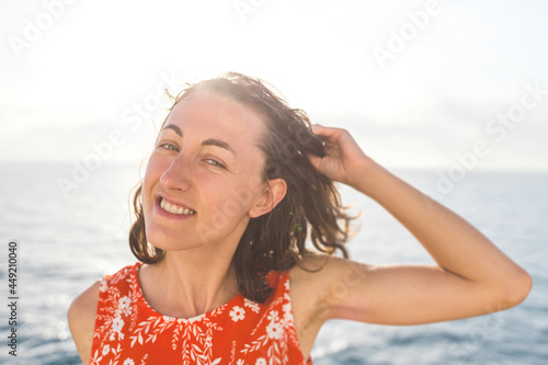 Woman with dark hair on the background of the sea © zhukovvvlad
