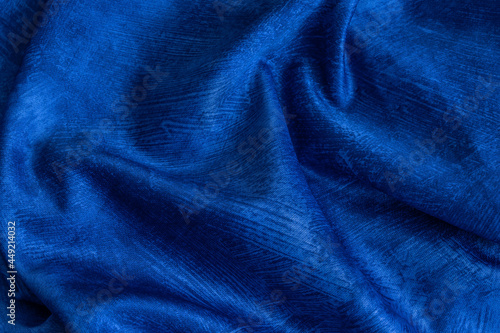 rinkled blue cotton fabric with visible texture