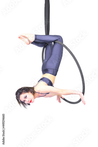 Beautiful woman Asian sport girl fly yoga posing on hoop isolated white background , Aerialist gymnastics performs physical exercises - yoga concept