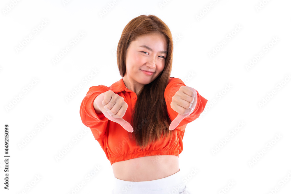 Beautiful cute girl Asian woman showing thumb down gesture with two hands on white background - lifestyle pretty girl concept Beautiful cute girl Asian woman showing thumb down gesture with two hands on white background - lifestyle pretty girl concept