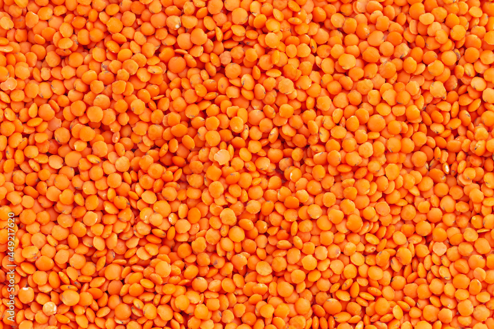 Organic raw red lentils background texture Organic raw red lentils background texture