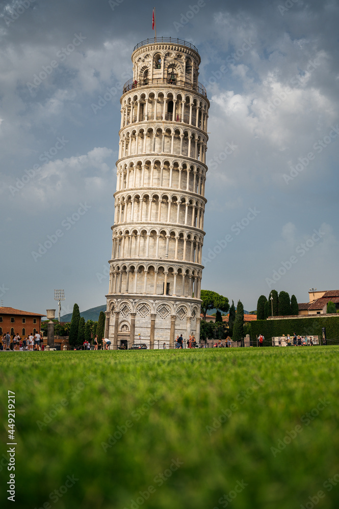 Leaning tower of Pisa from a low perspective with clouds