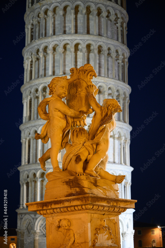 leaning tower of Pisa with Fontana dei Putti on Piazza dei Miracoli in Pisa during the blue hour