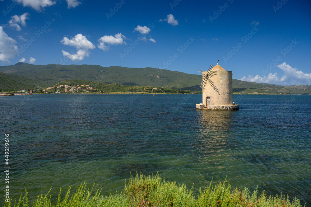 Ancient Spanish windmill in the lagoon of Orbetello, Tuscany