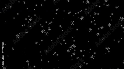 White snowflake falling on black background (seamless loop) photo