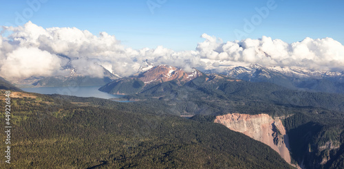 Aerial View from Airplane of Canadian Mountain Landscape. Sunny Summer Cloudy evening. Garibaldi between Squamish and Whistler, North of Vancouver, BC, Canada.