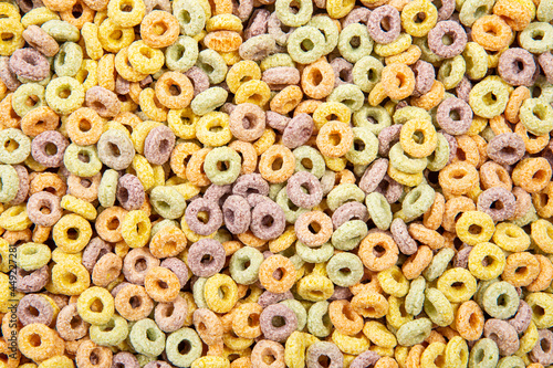 Multi color breakfast round cereal food background. photo