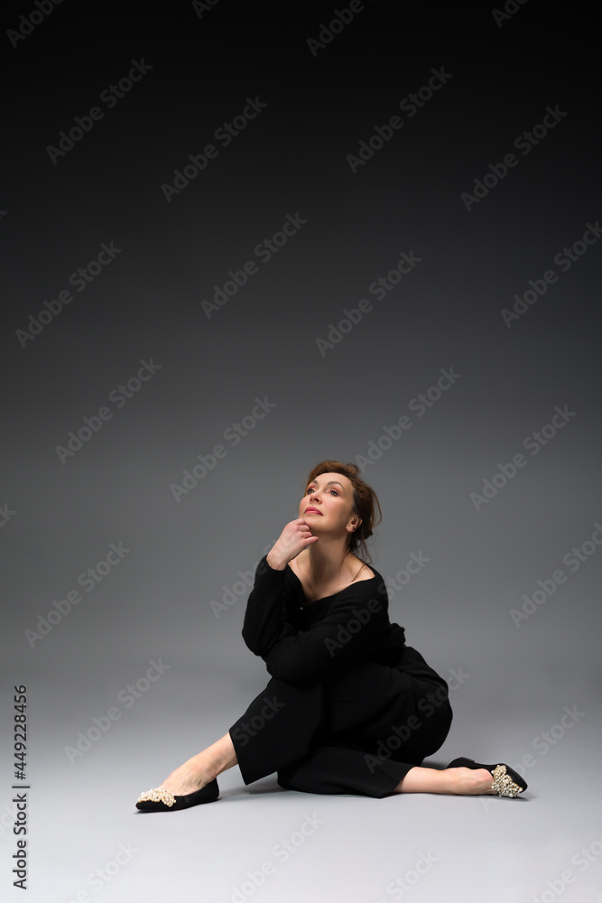 full length portrait of a fashionable aged woman isolated on grey full length portrait of a fashionable aged woman isolated on grey