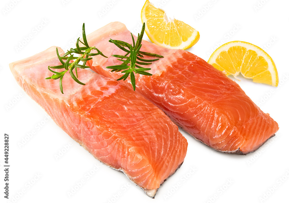 Red fish. Raw salmon fillet with rosemary and lemon isolate on white background. Clipping path and full depth of field.