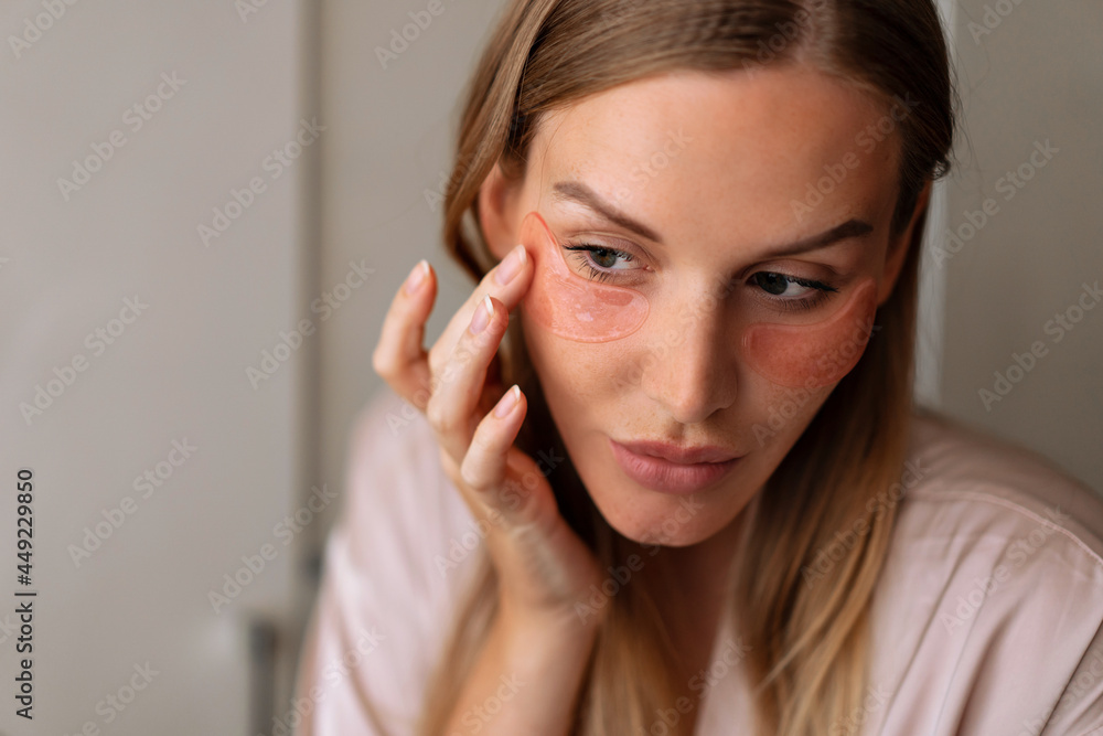 Close up portrait of woman using eye patches, skin care and face massage concept, natural skin, fresh pretty face. Close up portrait of woman using eye patches, skin care and face massage concept, natural skin, fresh pretty face.