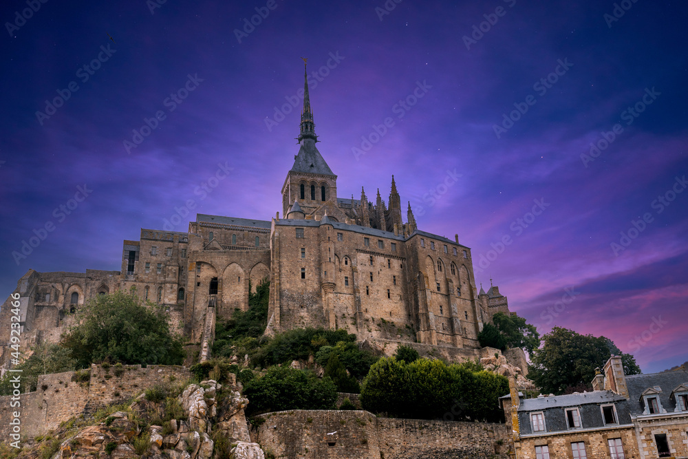 The famous Mont Saint-Michel Abbey at night in the Manche department, Normandy region, France
