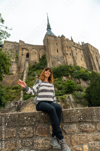 A young tourist visiting the famous Mont Saint-Michel Abbey in the Manche department, Normandy region, France