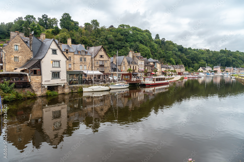 Houses and boats on the Rance river in Dinan medieval village in French Brittany, France