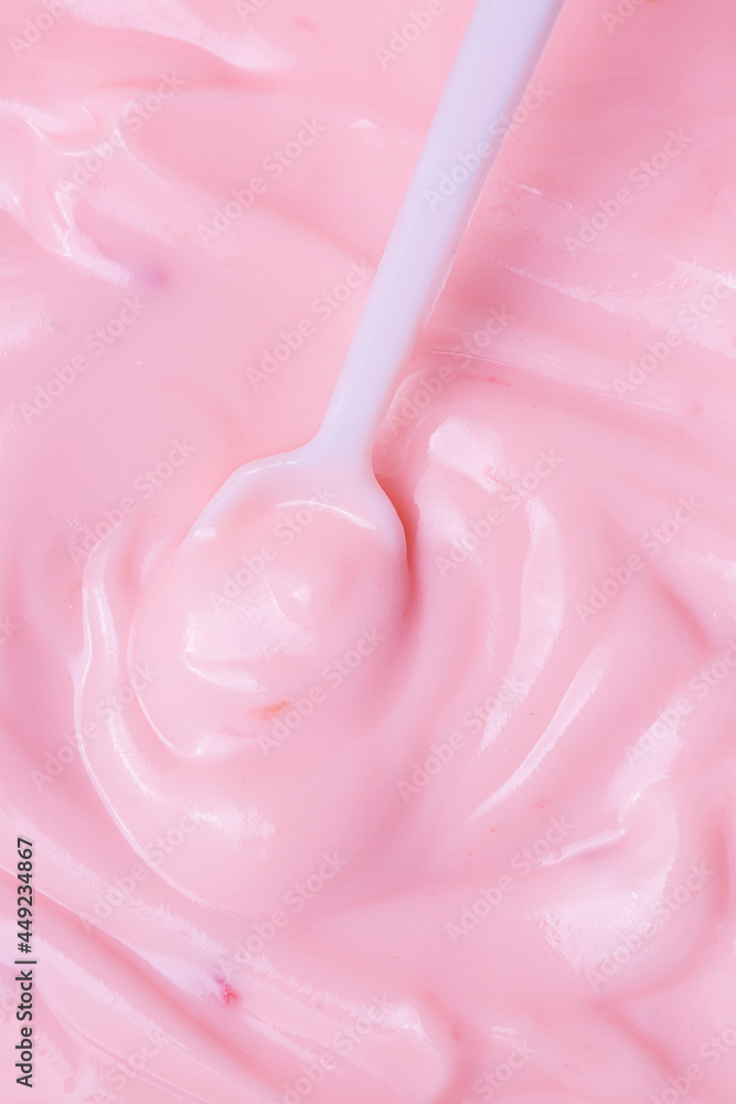 Macro Yogurt,Strawberry frozen yogurt background close up. Strawberry ice cream texture close up. Top view. Pink fruit ice cream background with small pieces of berries Macro Yogurt,Strawberry frozen yogurt background close up. Strawberry ice cream texture close up. Top view. Pink fruit ice cream background with small pieces of berries