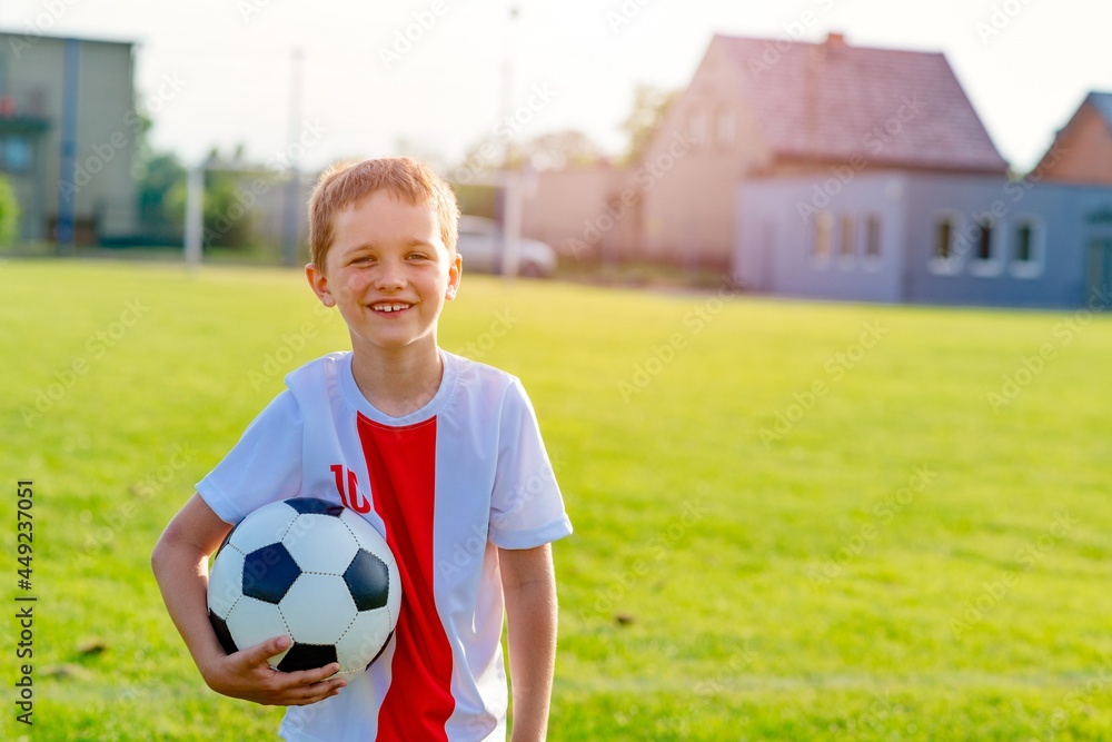 Obraz premium Young boy in football team. Active lifestyle concept.