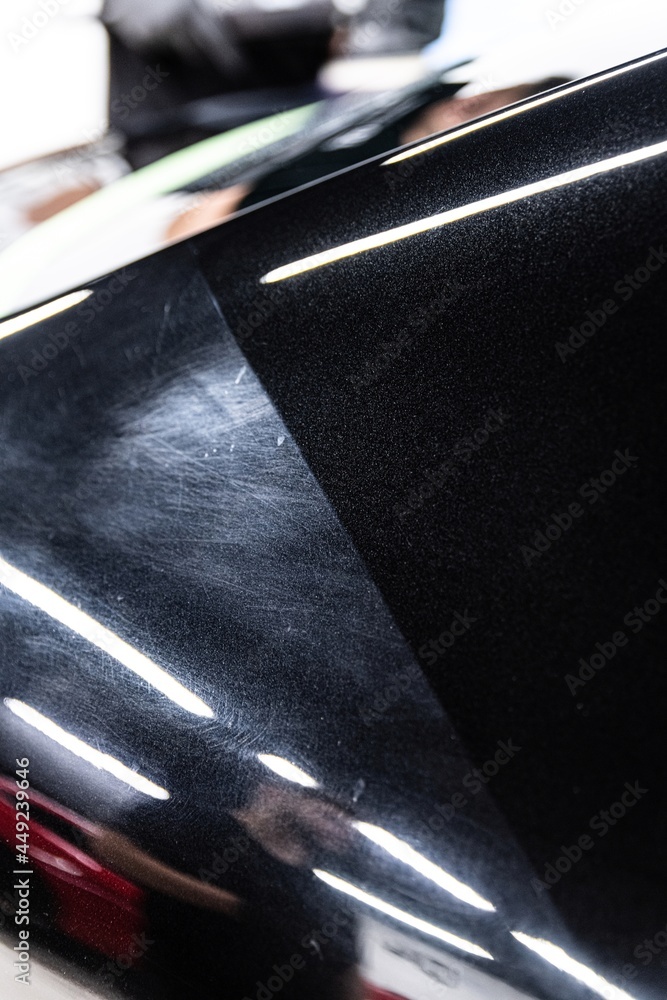 Before and after effect after car varnish renovation and paint correction in car detailing studio